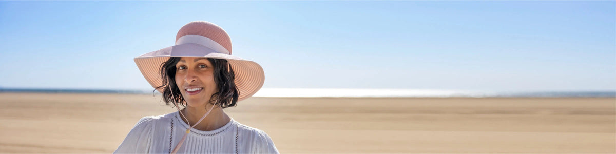 Woman wearing sun hat on beach